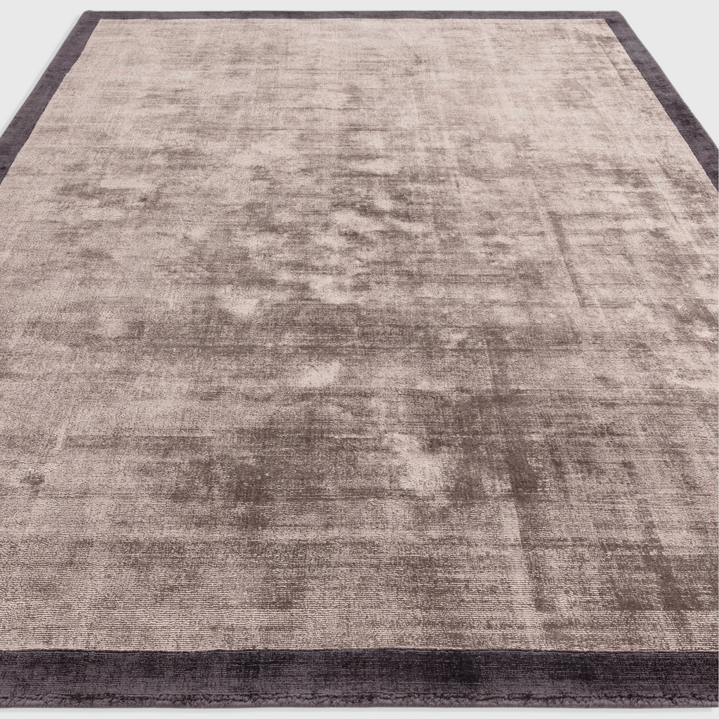 Alvo Rugs Blayde charcoal and moleskin viscose rug with a hand-woven two-tone border and soft tip-sheared texture.