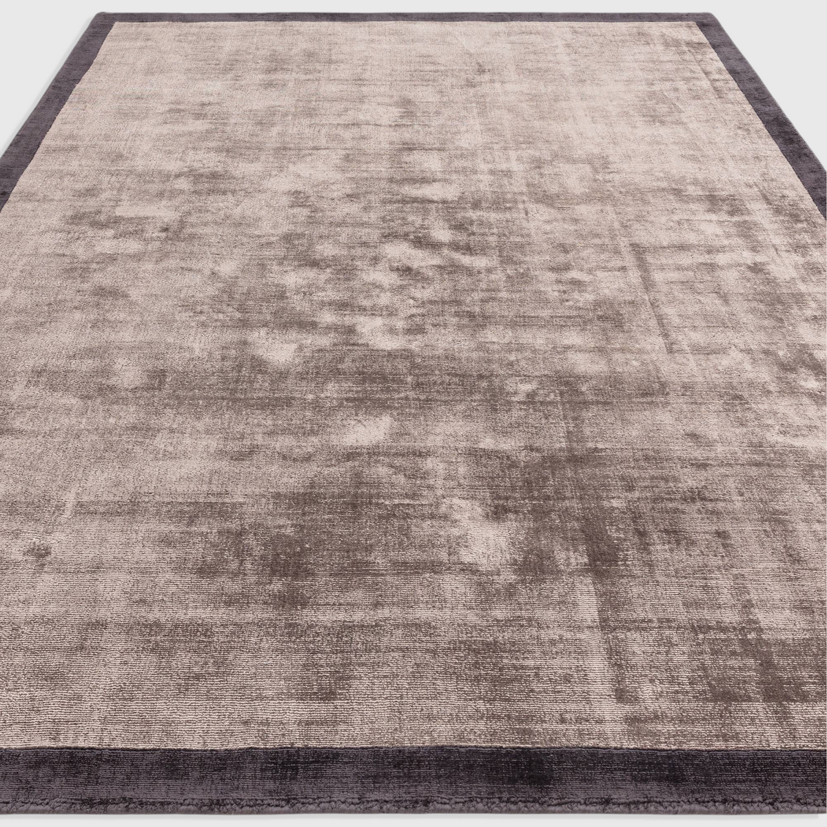 Alvo Rugs Blayde charcoal and moleskin viscose rug with a hand-woven two-tone border and soft tip-sheared texture.