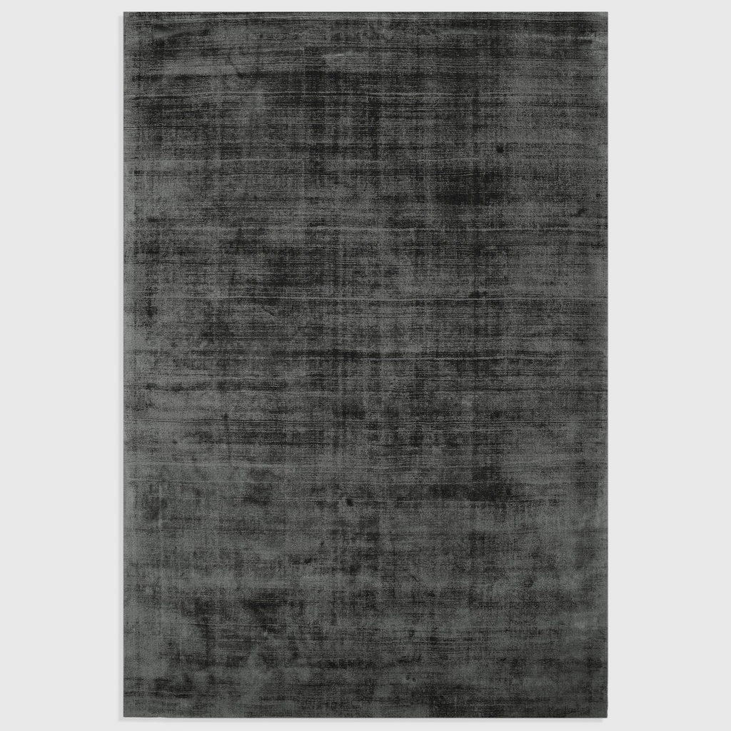 Alvo Rugs Blayde charcoal grey hand-woven viscose rug with a vintage tip-sheared finish and plain aesthetic.