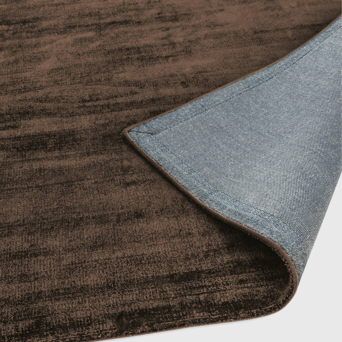 Alvo Rugs Blayde chocolate brown hand-woven viscose rug showing the textured pile and grey latex backing