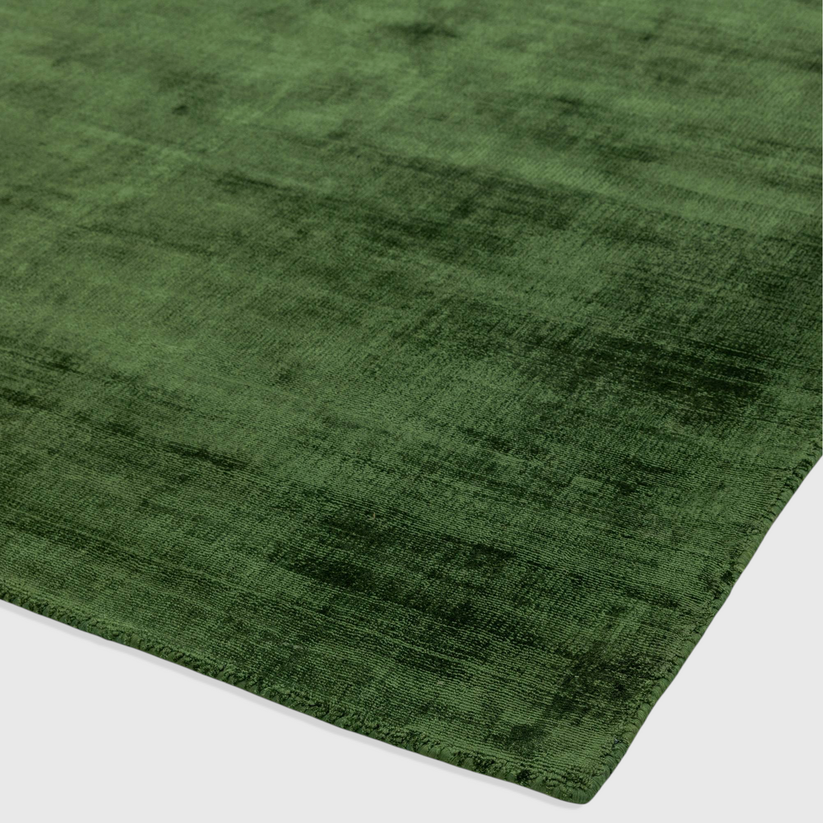 Alvo Rugs Blayde green hand-woven viscose rug with a vintage tip-sheared texture and soft loop pile finish.