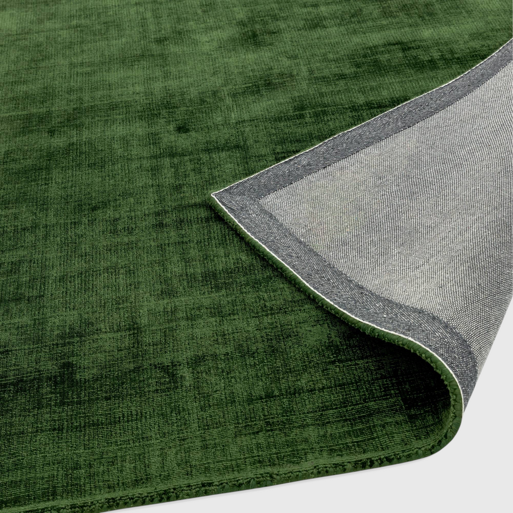 Alvo Rugs Blayde green hand-woven viscose rug showing the textured top surface and the durable latex backing