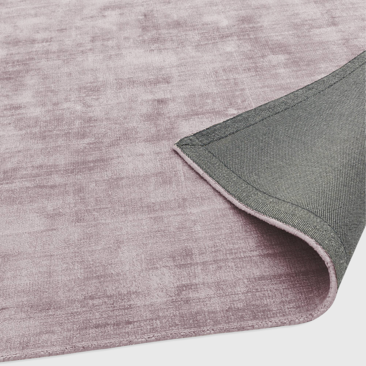 Alvo Rugs Blayde Heather purple viscose rug showing the soft hand-woven texture and durable grey latex backing.