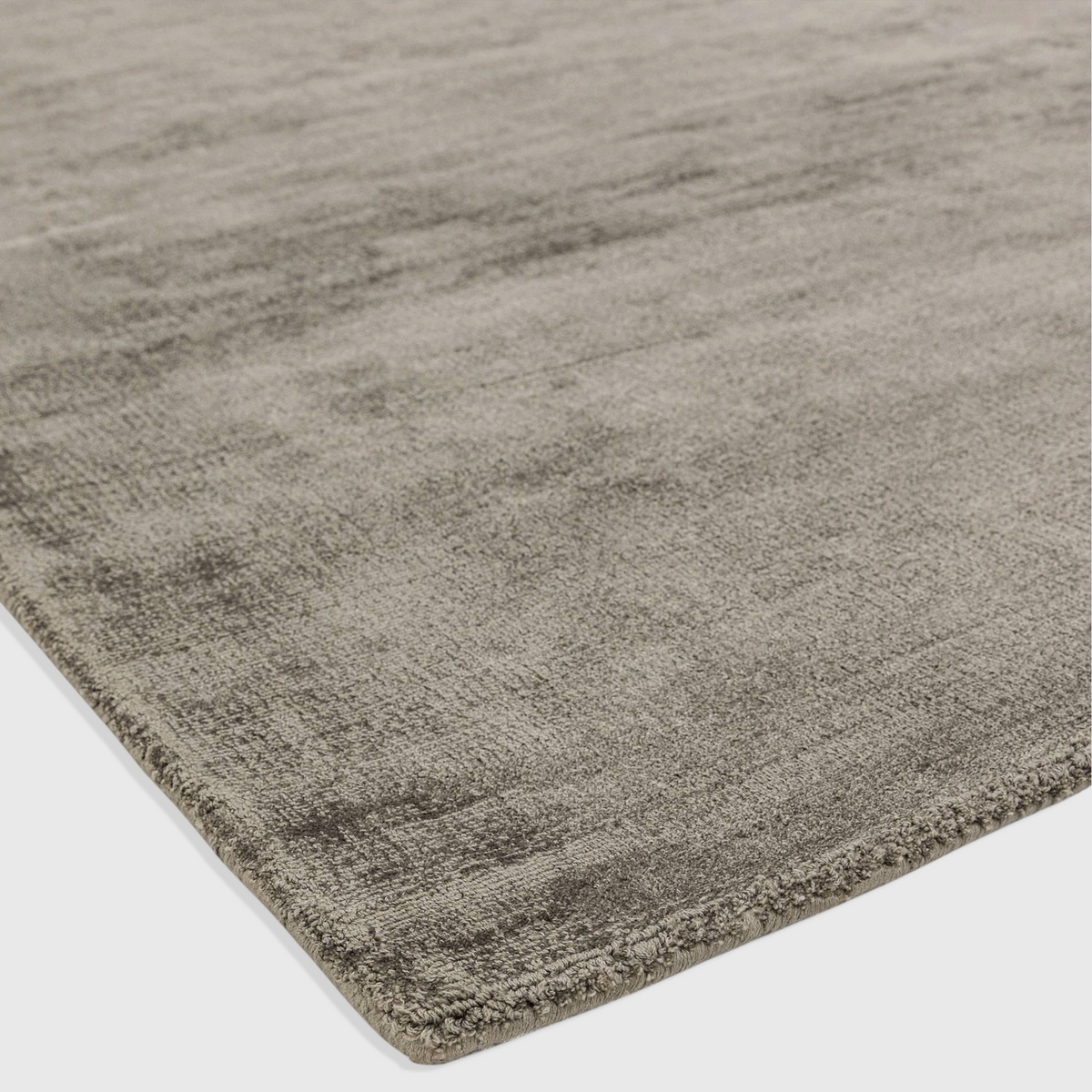 Alvo Rugs Blayde hand-woven viscose rug in a neutral beige tone with a vintage tip-sheared finish and loop pile.