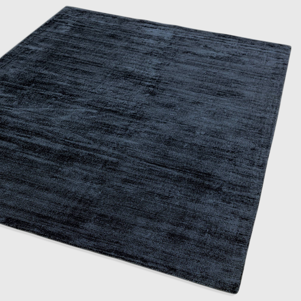 Alvo Rugs Blayde navy blue hand-woven viscose rug with a vintage tip-sheared texture and soft loop pile finish.