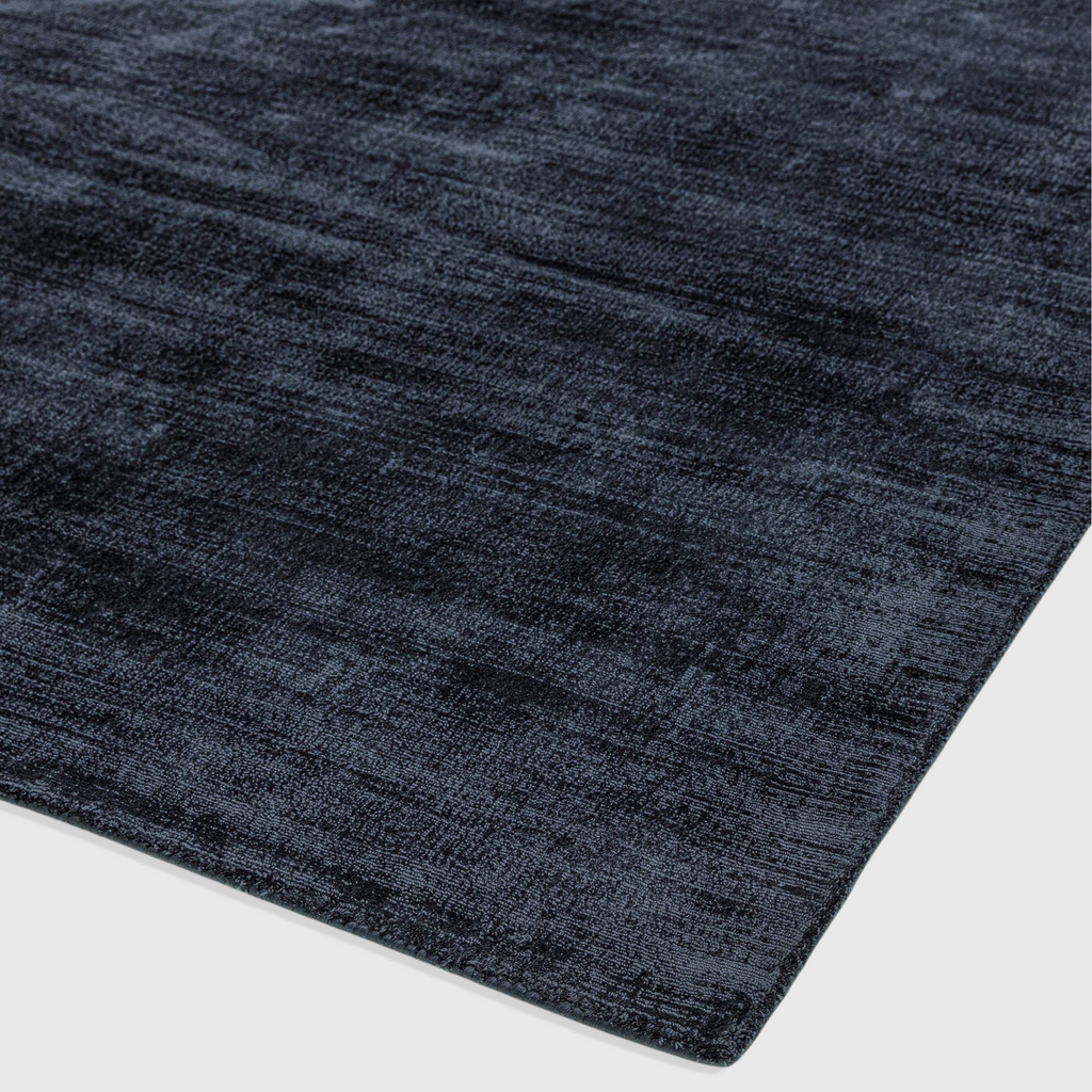 Alvo Rugs Blayde navy blue hand-woven viscose rug with a vintage tip-sheared texture and soft loop pile finish.