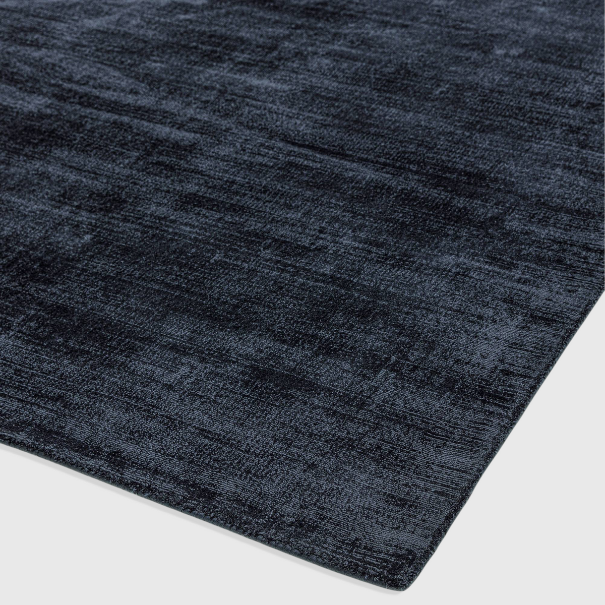 Alvo Rugs Blayde navy blue hand-woven viscose rug with a vintage tip-sheared texture and soft loop pile finish.