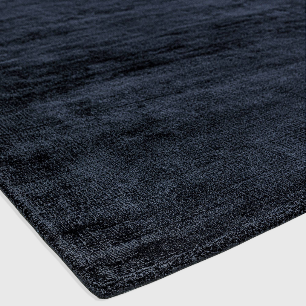 Alvo Rugs Blayde navy blue hand-woven viscose rug with a soft tip-sheared vintage texture and plain aesthetic.