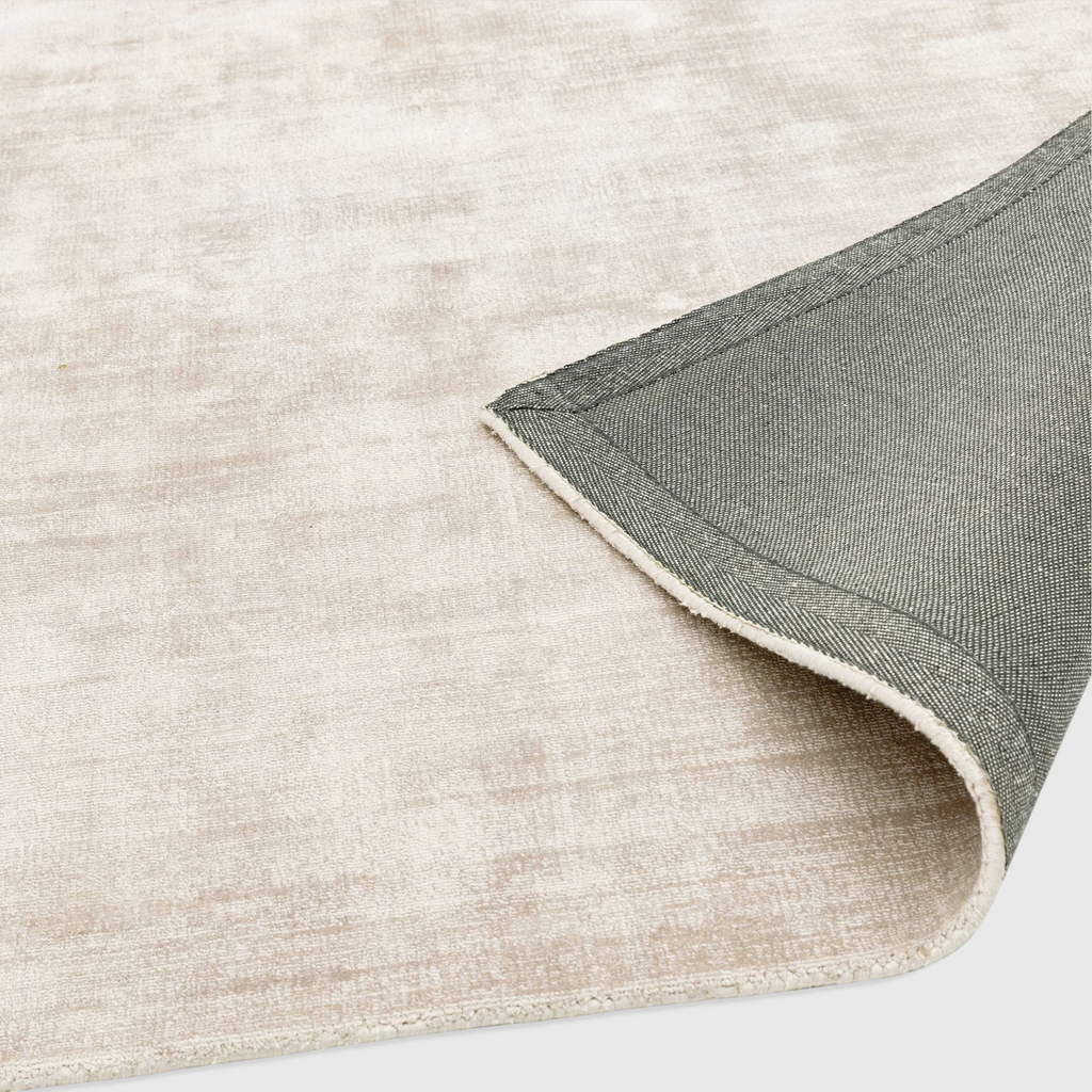 Alvo Rugs Blayde Putty hand-woven viscose rug in beige with a durable grey latex backing and tip-sheared vintage look.