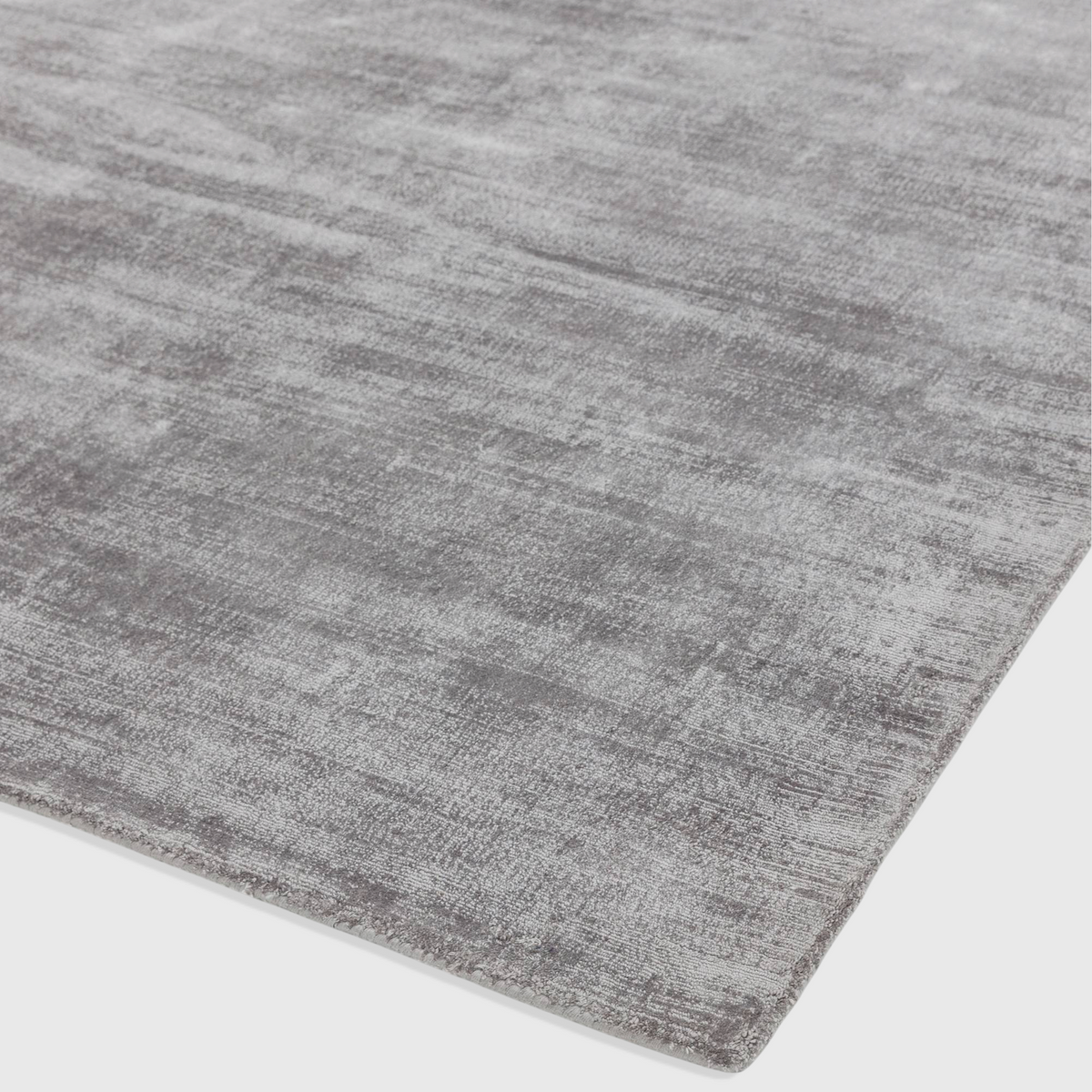 Alvo Rugs Blayde silver hand-woven viscose rug with a vintage tip-sheared finish and plain contemporary aesthetic.