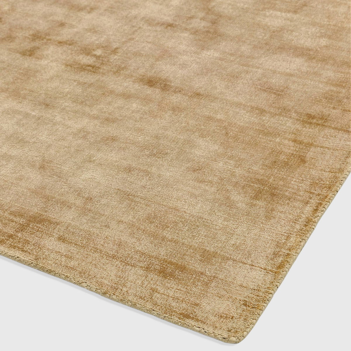 Alvo Rugs Blayde soft gold hand-woven viscose rug with a vintage tip-sheared texture and plain contemporary design.