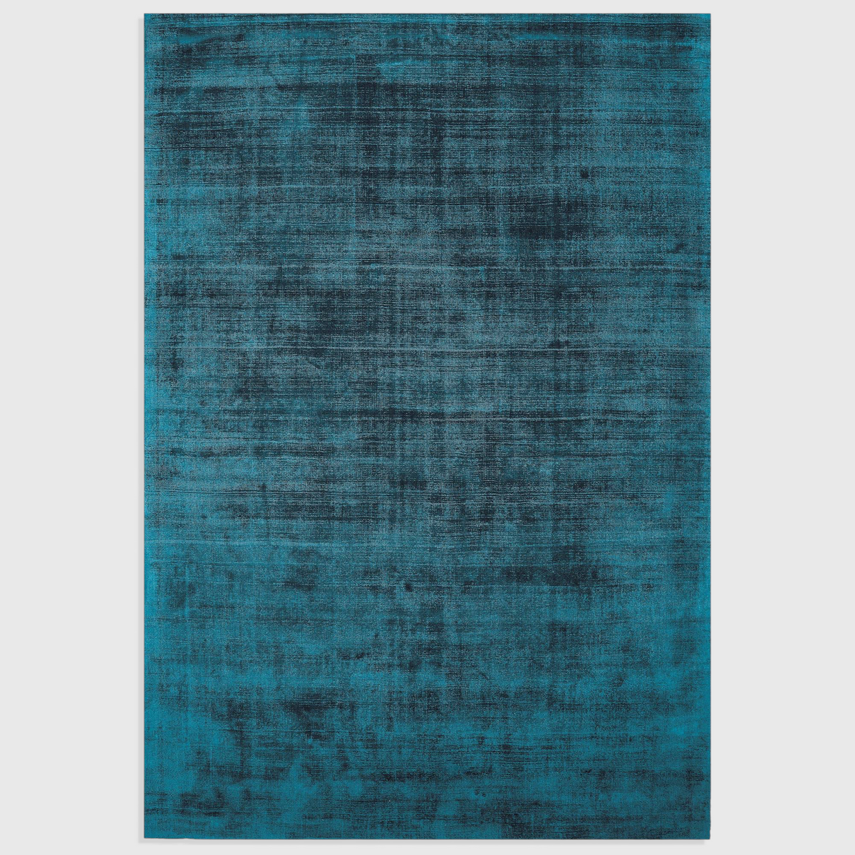 Alvo Rugs Blayde teal hand-woven viscose rug with a vintage-inspired tip-sheared texture and plain aesthetic.