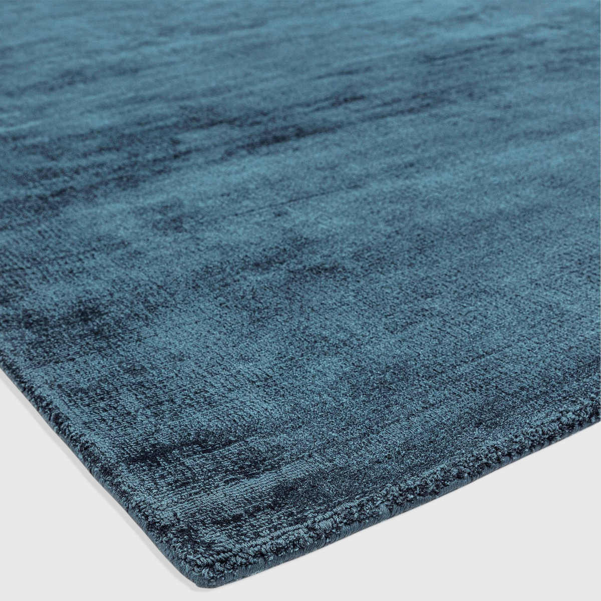 Alvo Rugs Blayde teal hand-woven viscose rug with a soft, tip-sheared vintage texture and plain contemporary design.