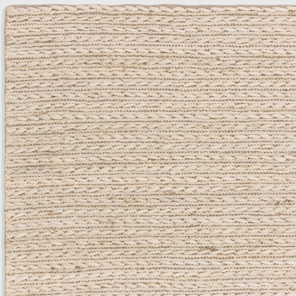 Alvo Rugs Oaks Blonde flatweave rug featuring a hand-woven natural jute and cotton blend in light white tones.