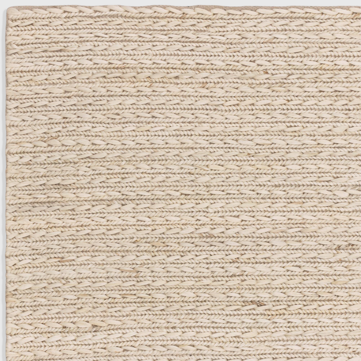 Alvo Rugs Oaks Blonde flatweave rug featuring a hand-woven natural jute and cotton blend in light white tones.
