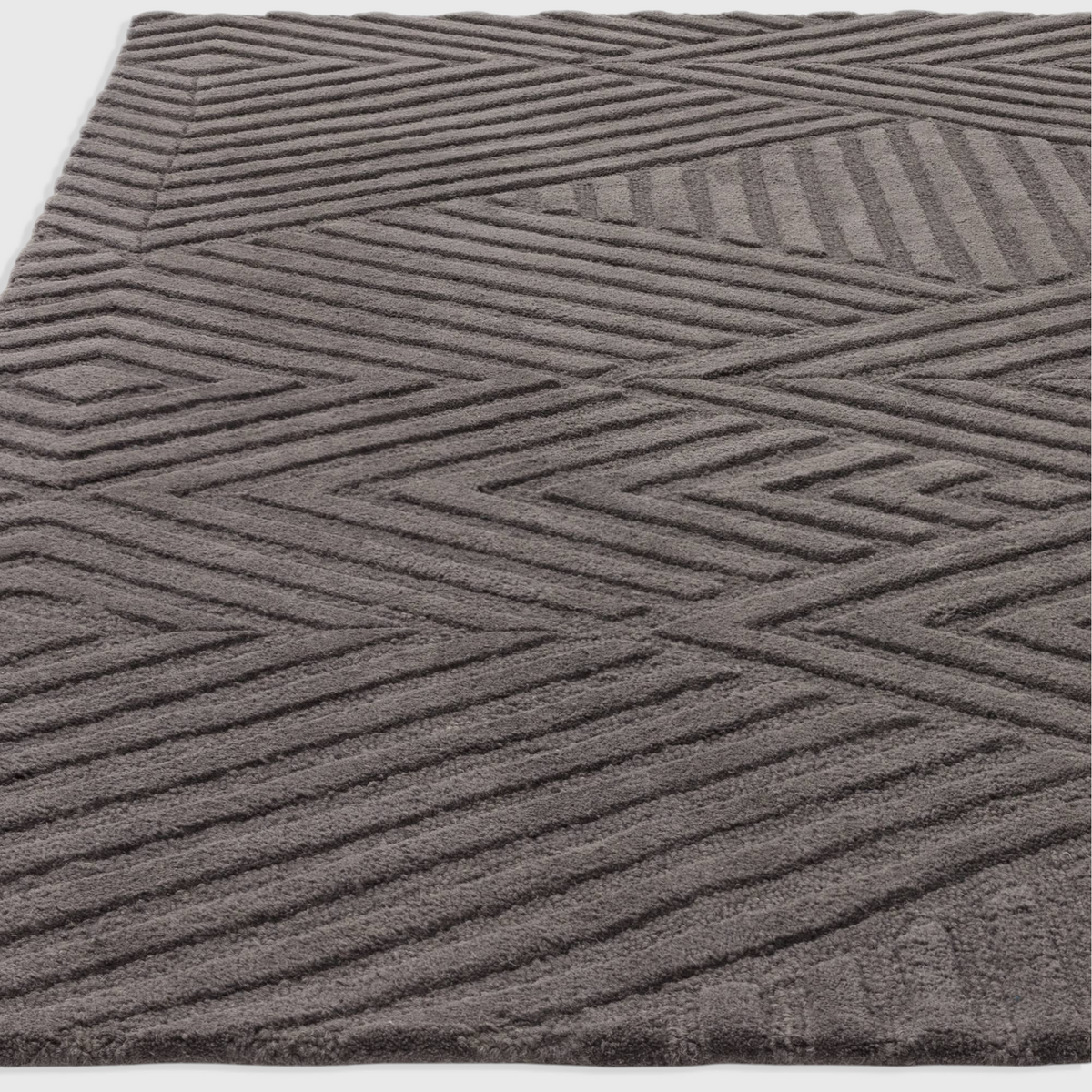 Alvo Rugs Hagia charcoal grey wool rug with geometric cut and loop pile texture in a contemporary style