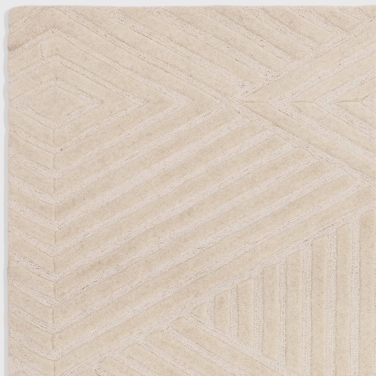 Alvo Rugs Hagia ivory wool rug with geometric cut and loop pile texture in a contemporary cream design