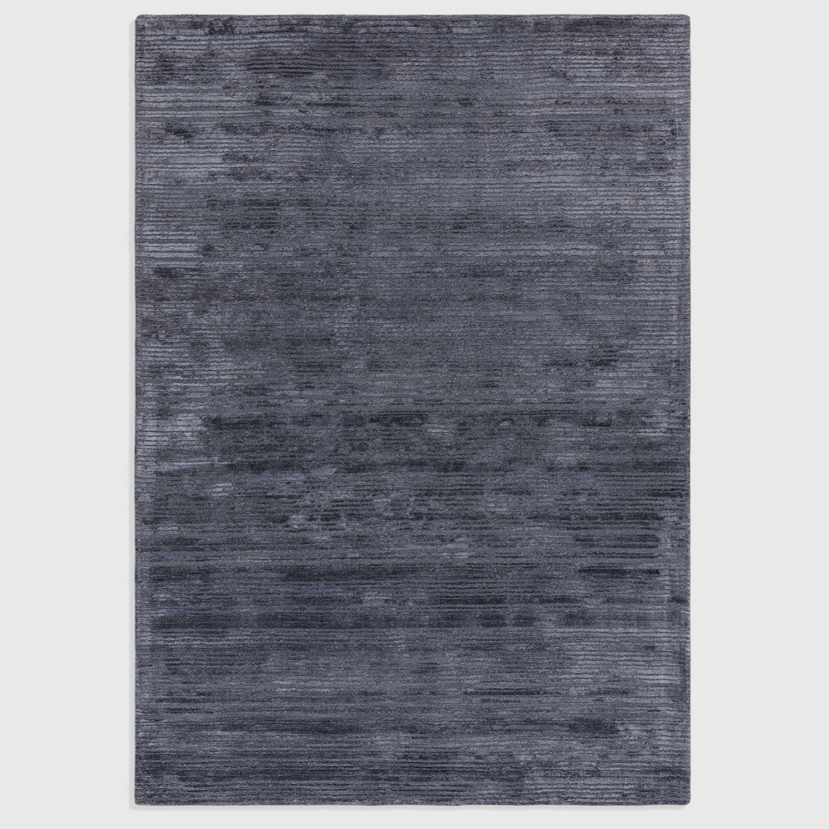 Alvo Rugs Henlee petrol blue hand-woven rug with a textured cut and loop wool and viscose pile.