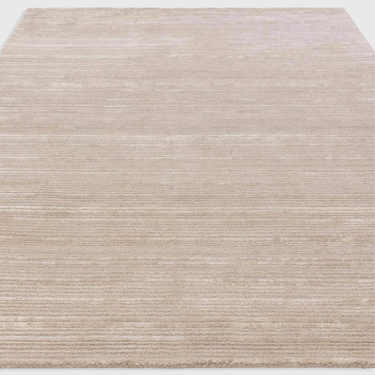 Alvo Rugs Henlee putty rug featuring a hand-woven wool and viscose blend with a textured cut and loop pile design.