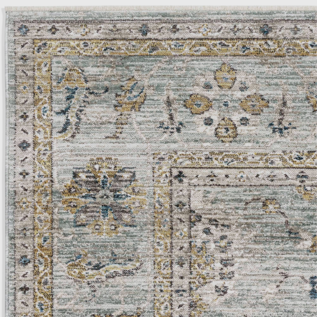 Alvo Rugs Jaspere Ja01 area rug featuring a classic antique design in blue and neutral tones with a low pile finish.