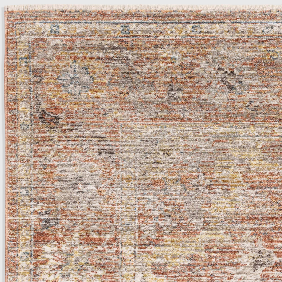 Alvo Rugs Jaspere Ja05 low pile area rug featuring a distressed antique design in warm red and neutral tones.