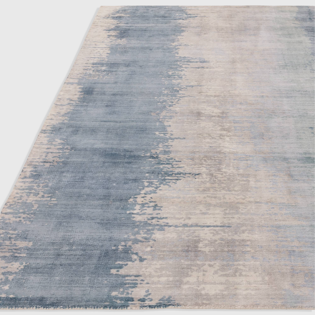 Alvo Rugs Junow aquamarine abstract rug featuring hand-woven viscose in soft blue and grey tones with a loop pile.