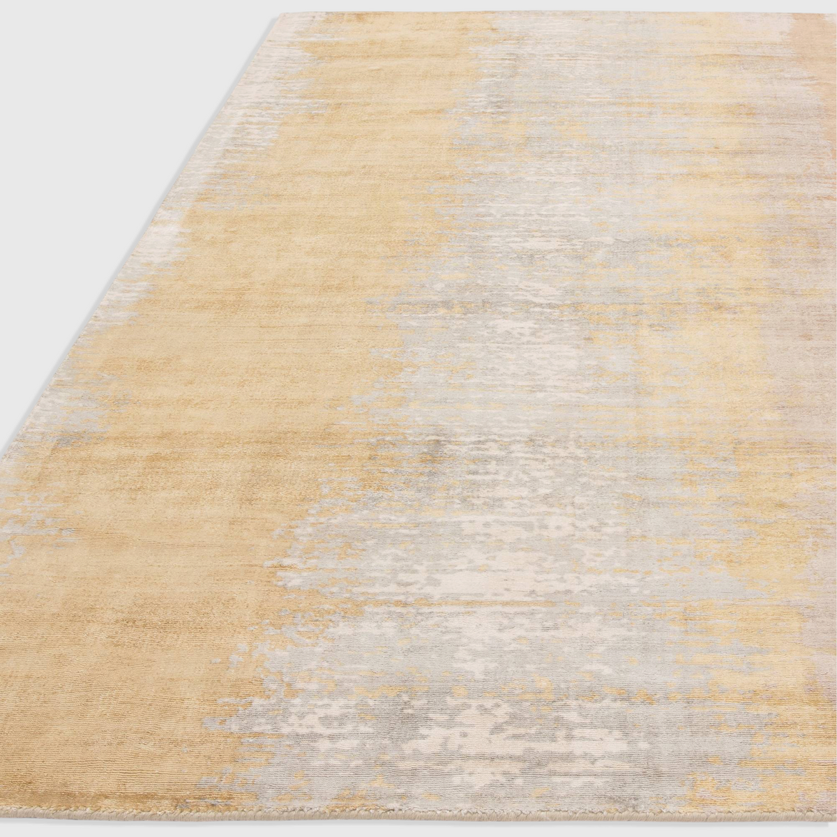 Alvo Rugs Junow Citrine hand-woven viscose rug with an abstract yellow and grey pattern and soft loop pile texture.