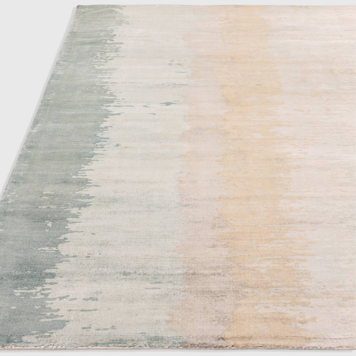 Alvo Rugs Junow Verdant rug featuring an abstract hand-woven design in soft green and beige viscose tones.