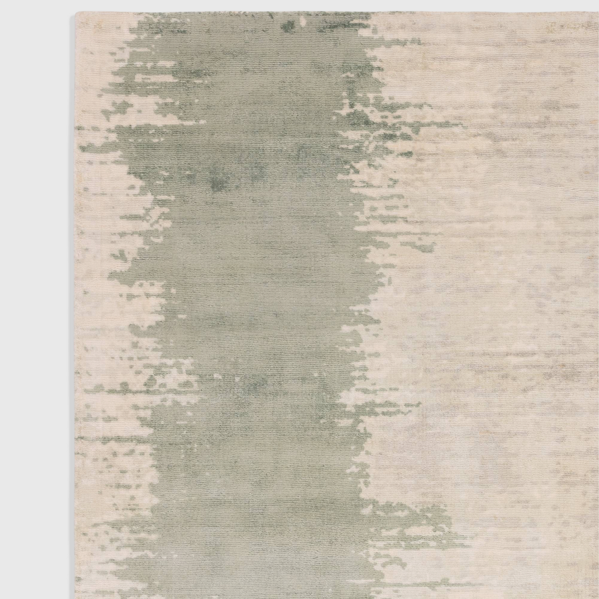 Alvo Rugs Junow Verdant hand-woven viscose rug featuring an abstract green and cream pattern with a soft loop pile.