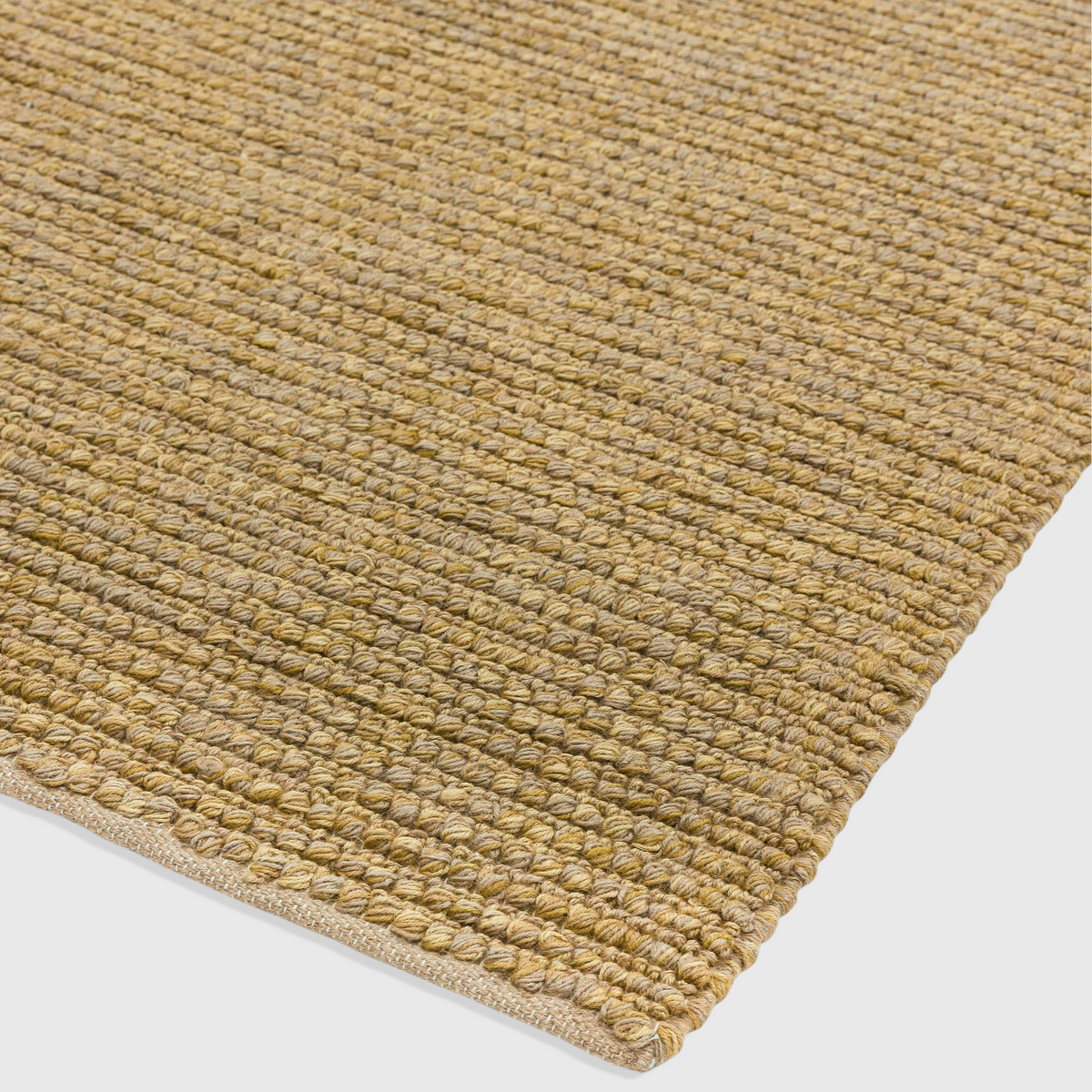 Alvo Rugs Juta Loop natural hand-woven flatweave rug with a textured beige jute surface in a close-up view.
