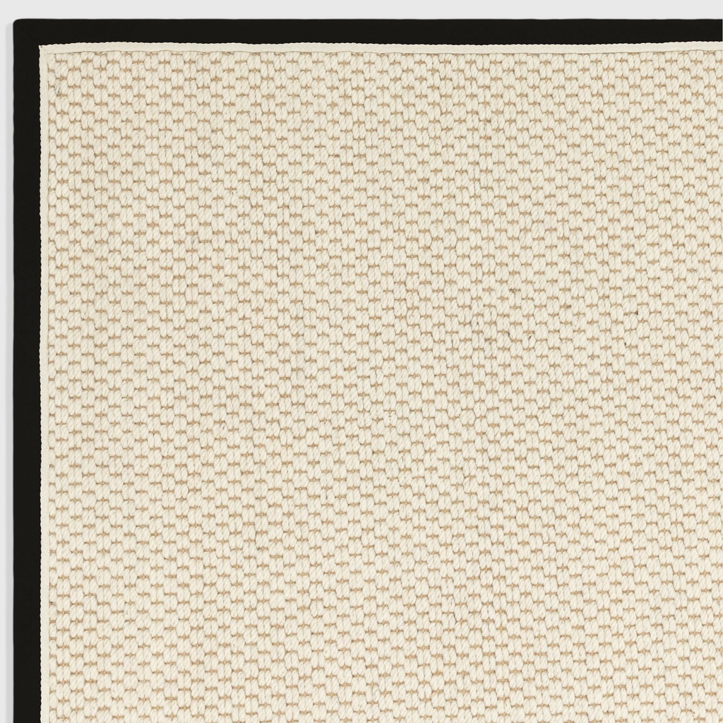Alvo Rugs Kori charcoal and cream wool-jute rug with a textured double loop pattern and a solid black cotton border.
