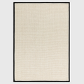 Alvo Rugs Kori charcoal and cream flatweave rug with a textured wool and jute loop design and a dark border.
