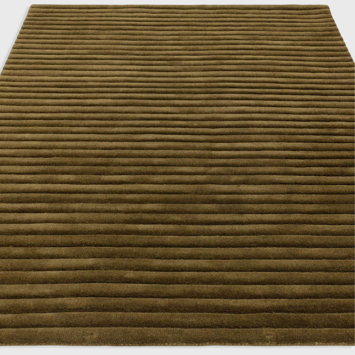 Alvo Rugs Lina Forest green wool rug featuring a textured high-low ridged pile design for a soft, modern aesthetic.