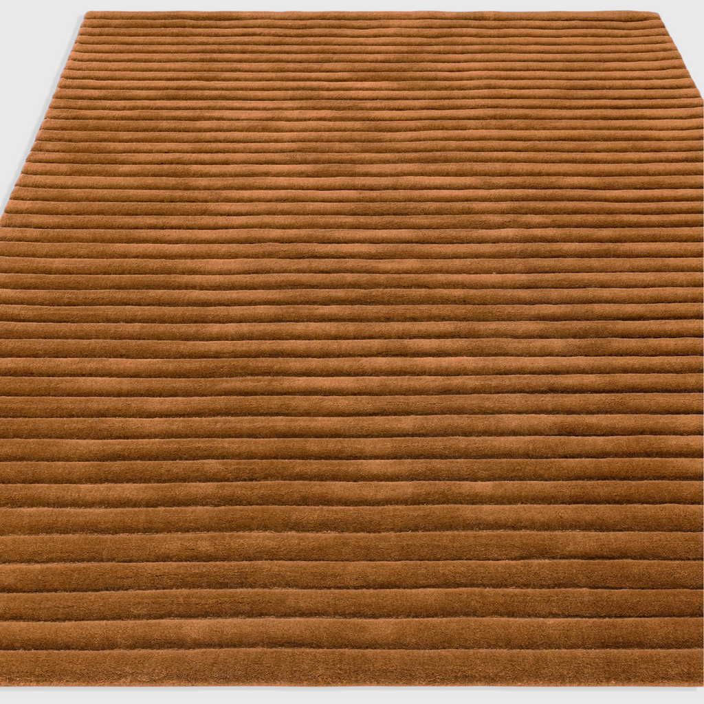 Alvo Rugs Lina Gold rug featuring a textured golden-yellow wool surface with horizontal ridged high-low pile design.