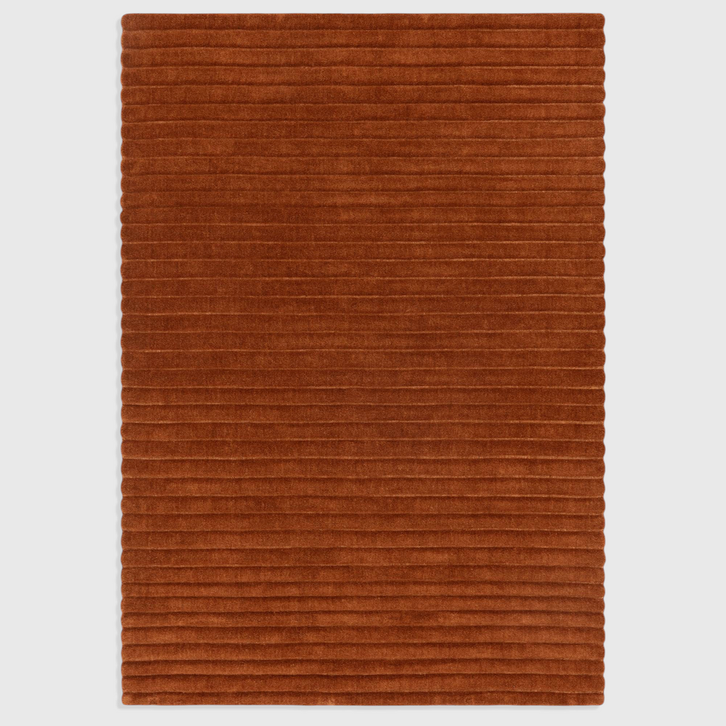 Alvo Rugs Lina rust orange hand-woven wool rug with a textured high-low ridged pile design.