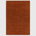 Alvo Rugs Lina rust orange hand-woven wool rug with a textured high-low ridged pile design.