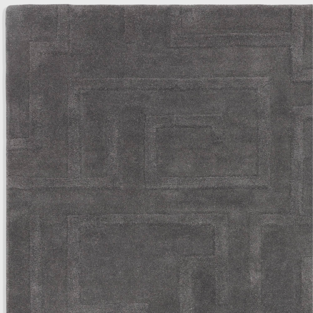 Alvo Rugs Maize charcoal grey wool rug with a high-low pile geometric maze pattern and soft hand-tufted texture.