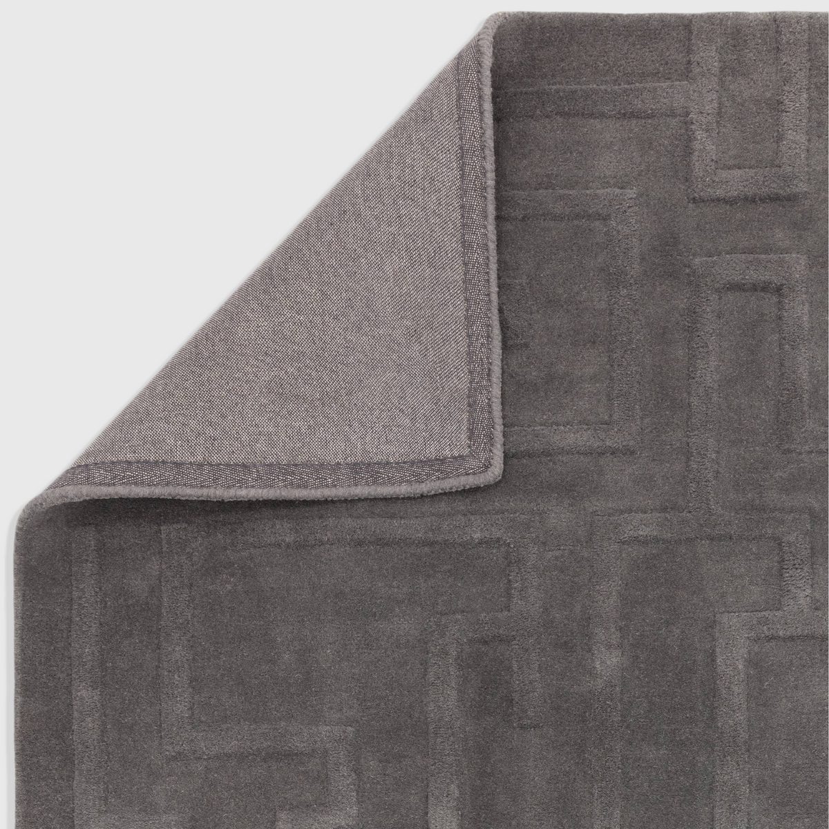 Alvo Rugs Maize charcoal grey wool rug with a high-low pile geometric maze pattern and durable latex backing.