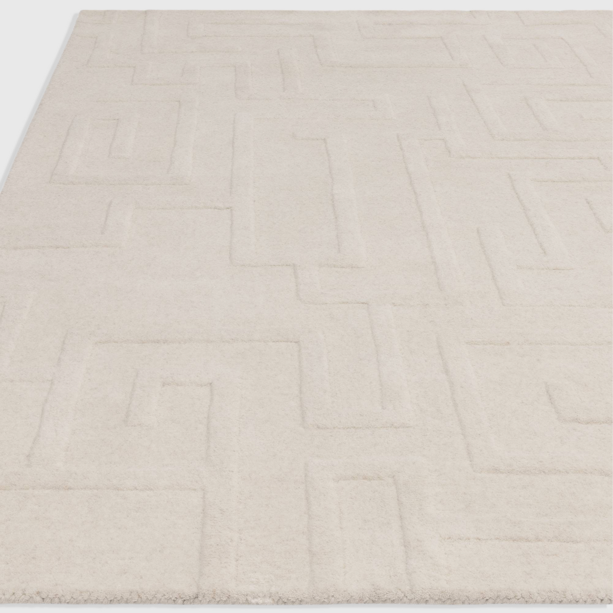 Alvo Rugs Maize cream hand-tufted wool rug featuring a subtle high-low pile geometric maze pattern.