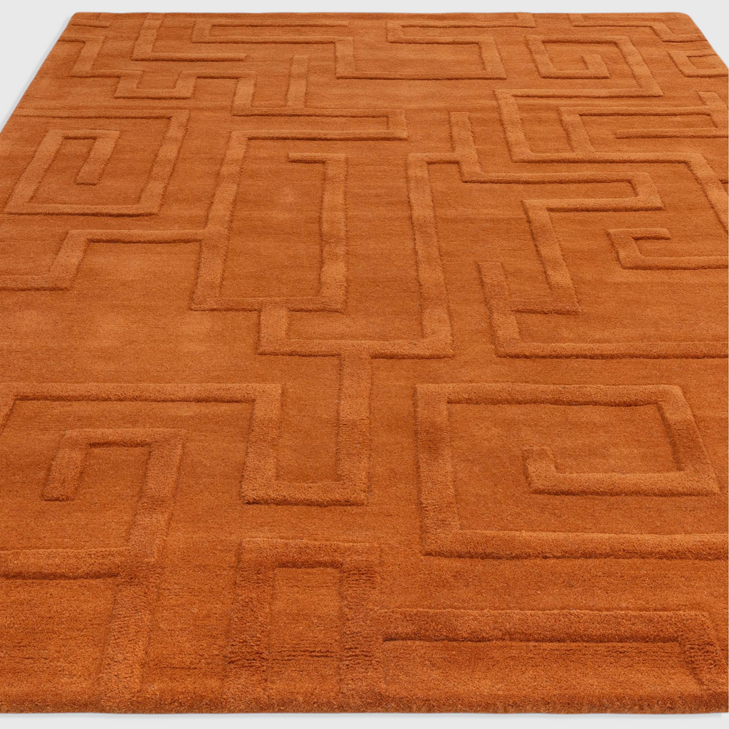 Alvo Rugs Maize Rust wool rug with a high-low pile geometric maze pattern in a warm orange tone.