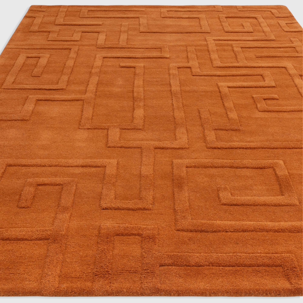 Alvo Rugs Maize Rust wool rug with a high-low pile geometric maze pattern in a warm orange tone.