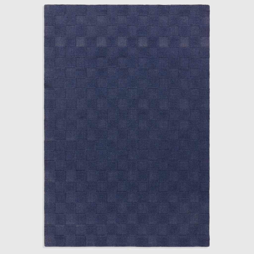 Alvo Rugs Mercia cobalt blue hand-woven wool rug with a textured square pattern and loop pile finish.