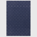 Alvo Rugs Mercia cobalt blue hand-woven wool rug with a textured square pattern and loop pile finish.