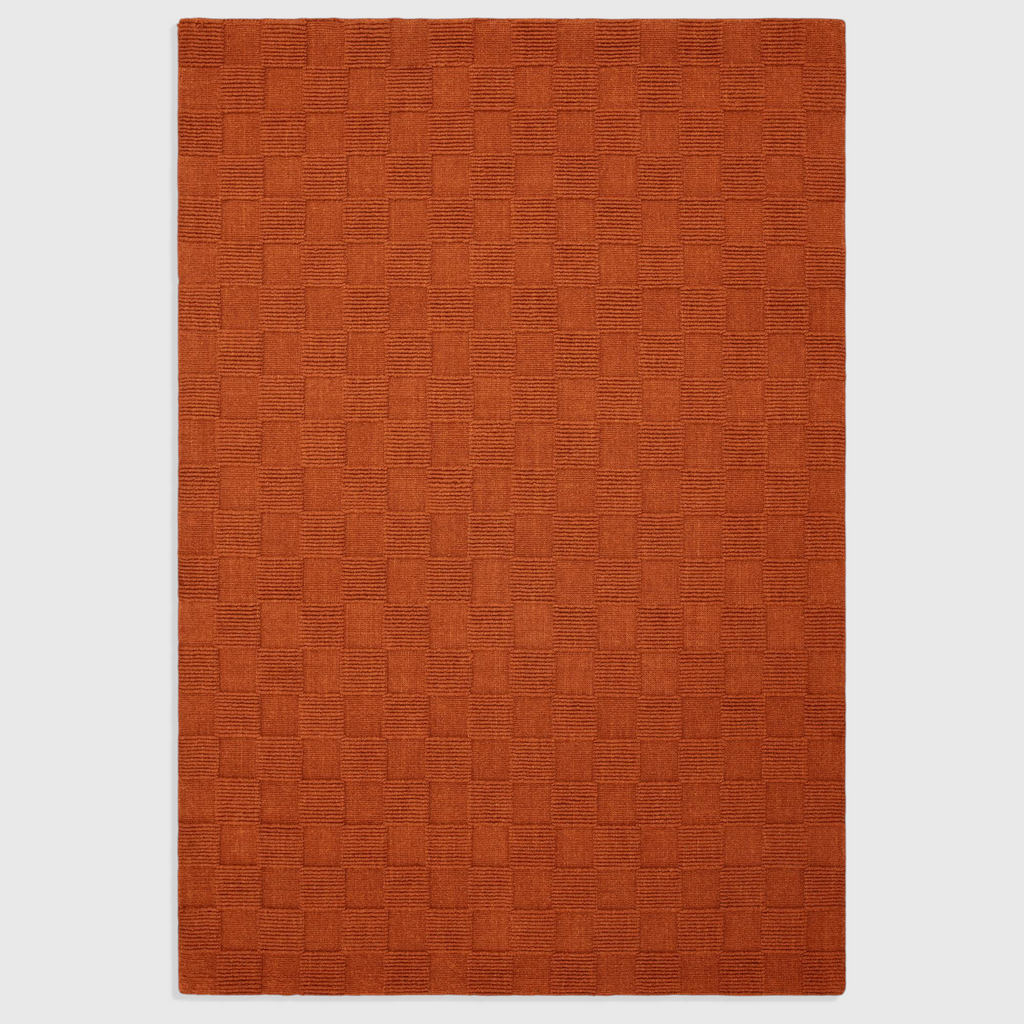 Alvo Rugs Mercia rust orange hand woven wool rug with a textured square loop pile pattern
