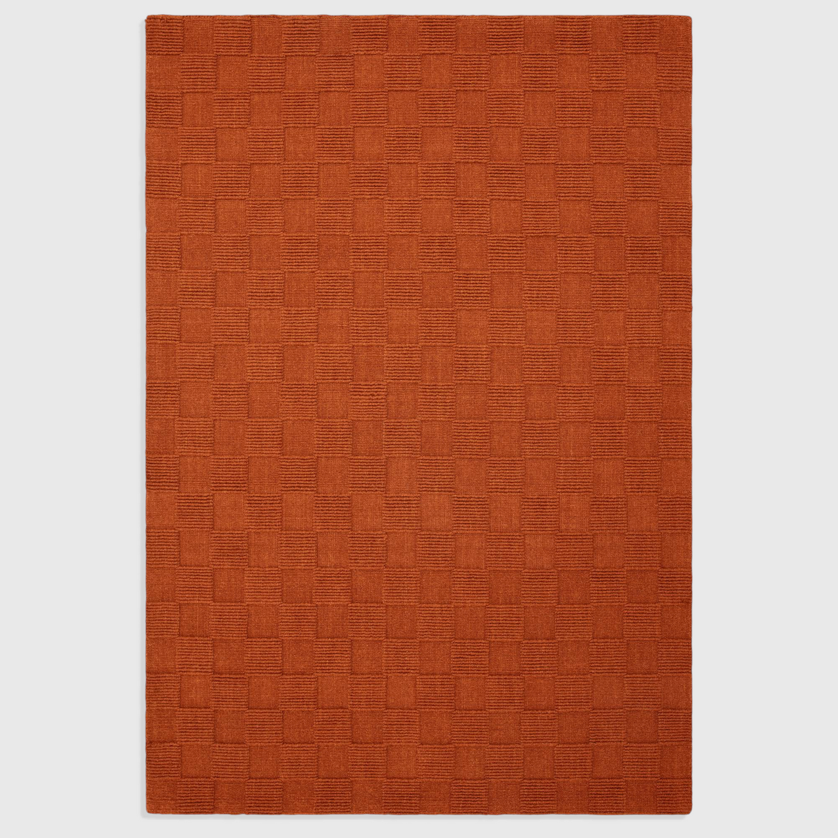 Alvo Rugs Mercia rust orange hand woven wool rug with a textured square loop pile pattern