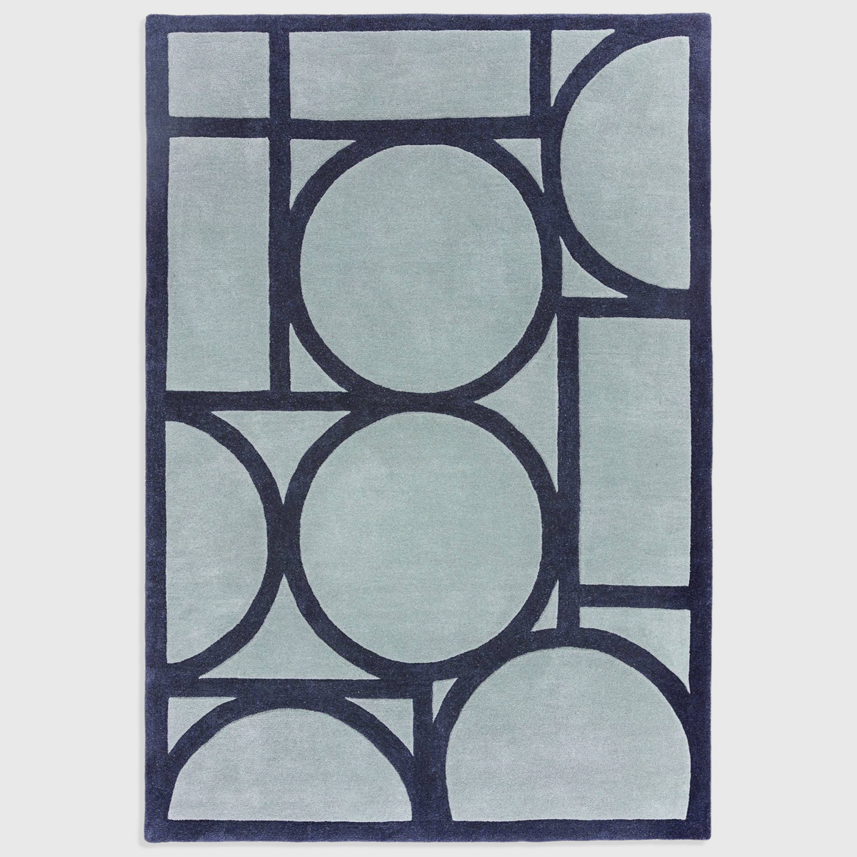 Alvo Rugs Metra blue wool rug with a hand-tufted geometric pattern and high-low pile texture.