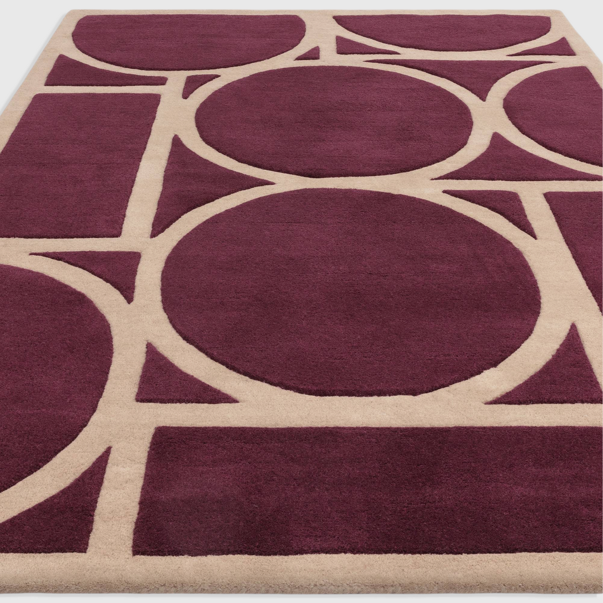 Alvo Rugs Metra Plum hand-tufted wool rug featuring a modern geometric circle and rectangle pattern in purple and beige.
