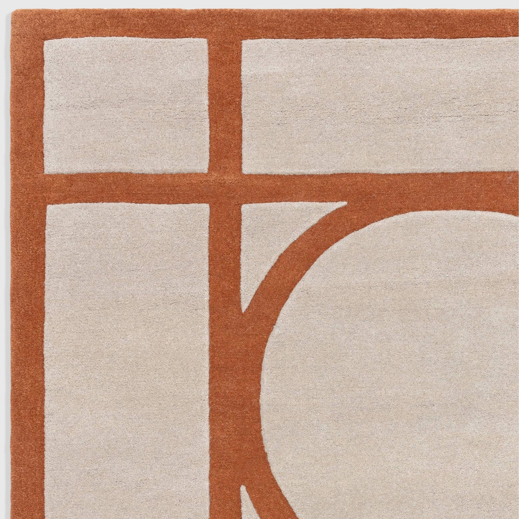 Alvo Rugs Metra rust wool rug featuring a geometric pattern with high-low pile in orange and cream tones.