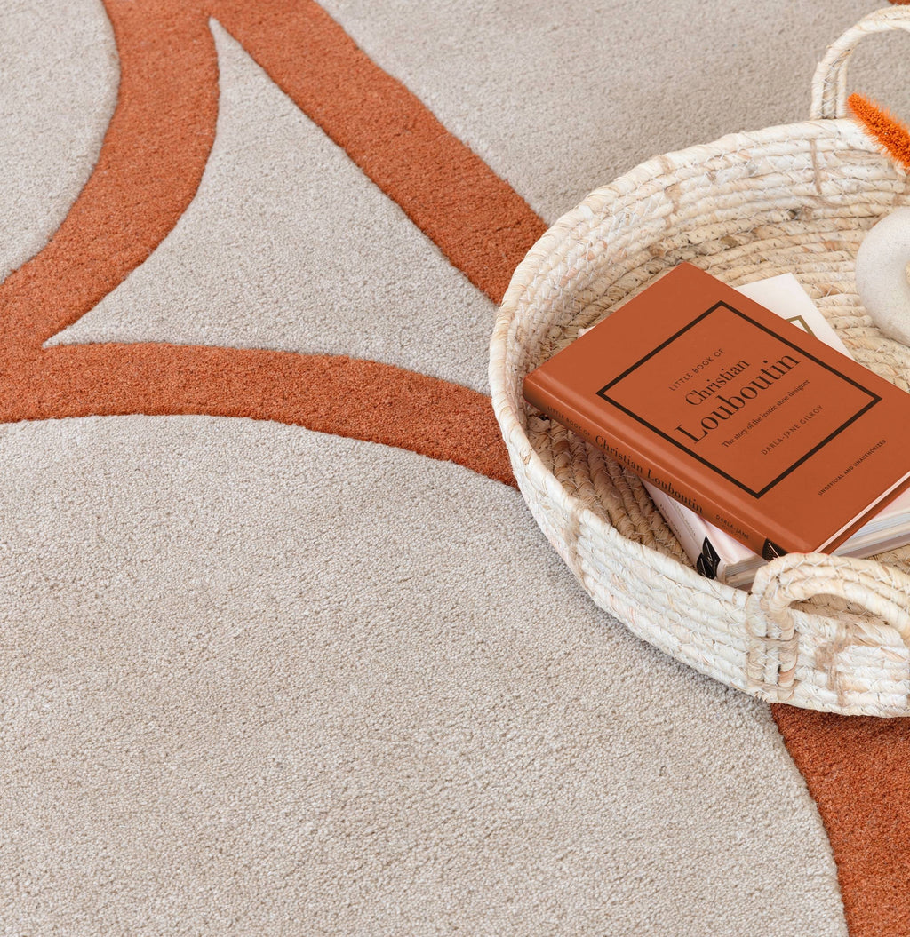 Alvo Rugs Metra Rust rug featuring a textured geometric pattern in warm orange tones, hand tufted from 100% wool.