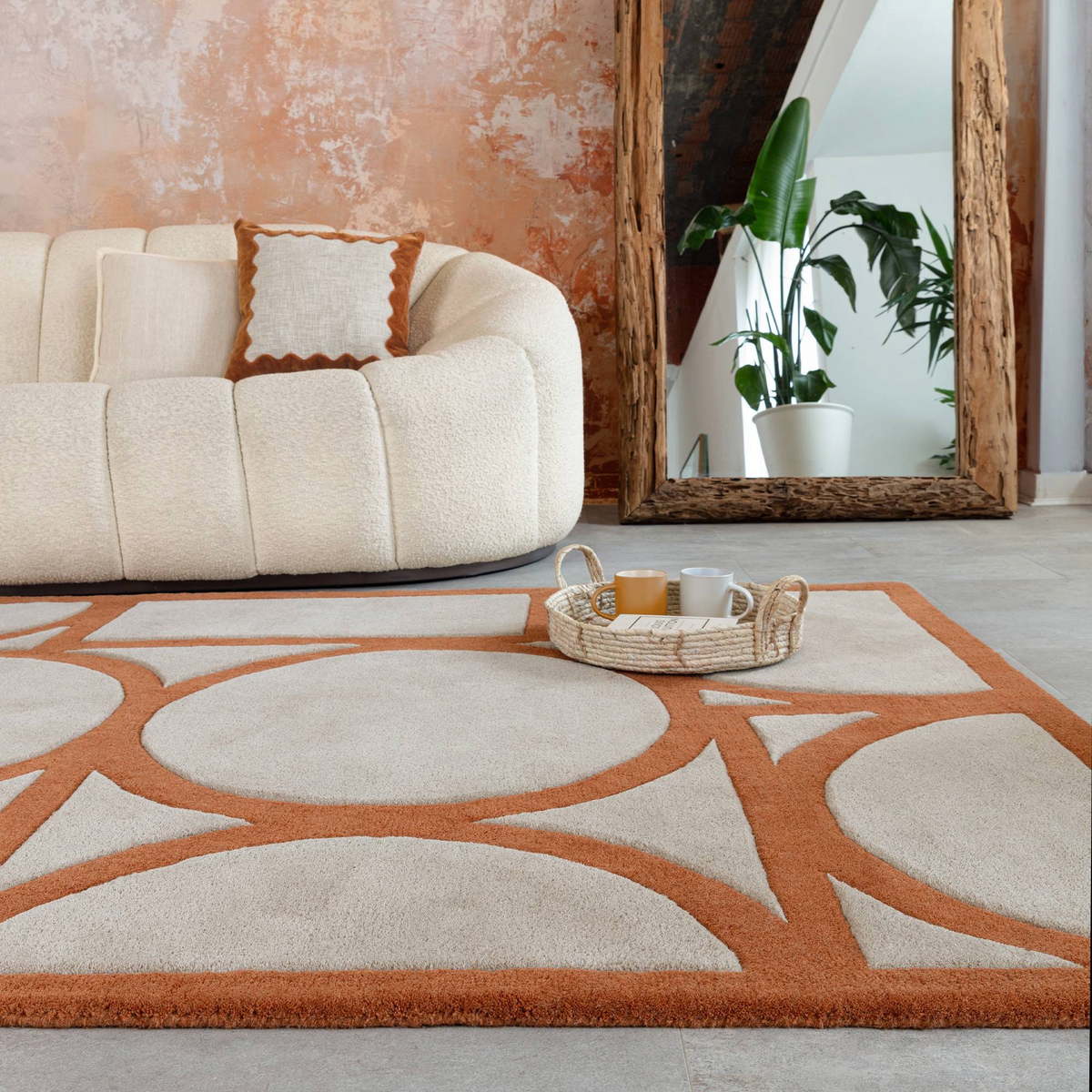 Alvo Rugs Metra rust wool rug with geometric pattern and high-low pile in a modern living room setting